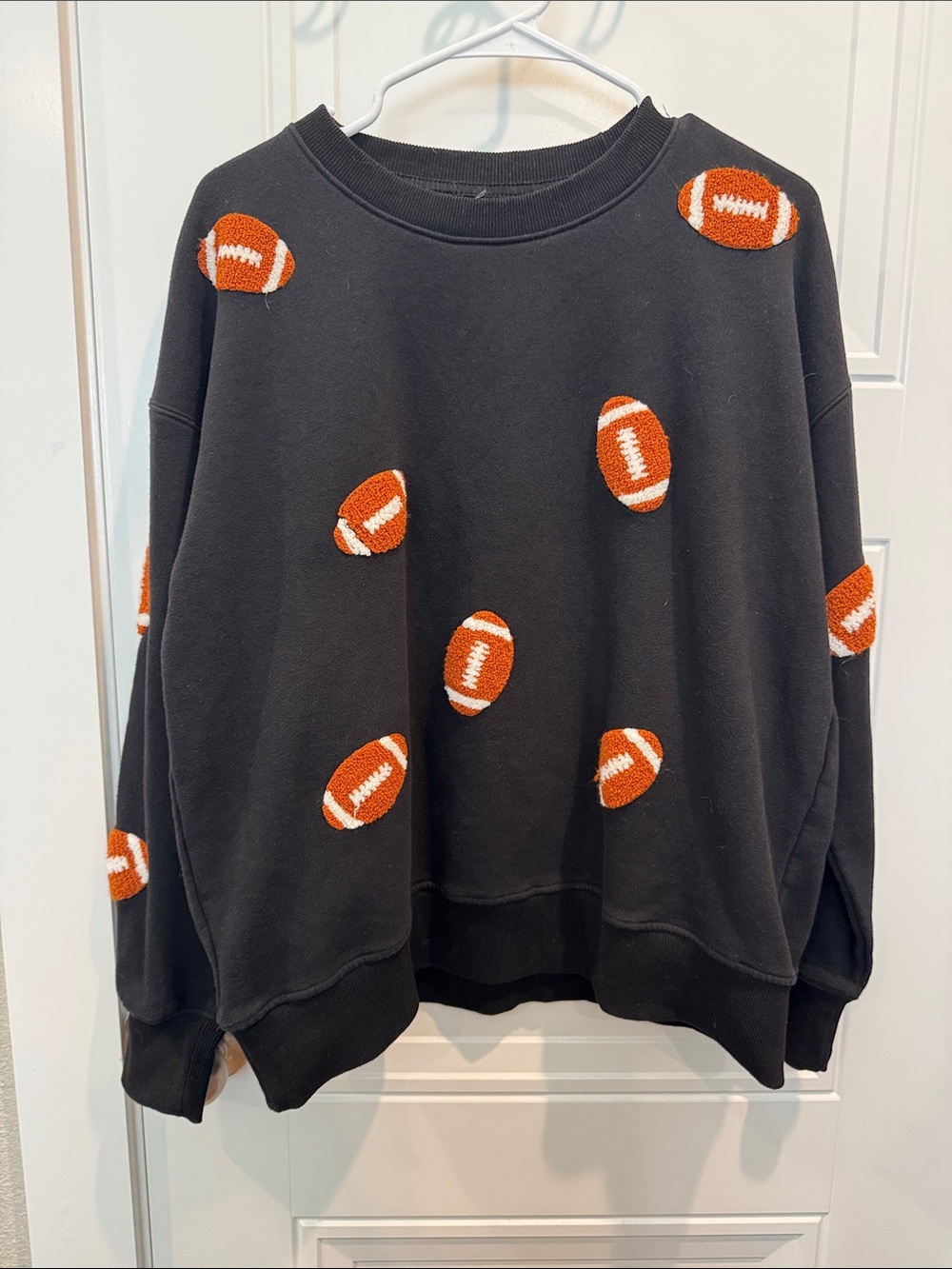 Black Sweatshirt with Orange Football Motif